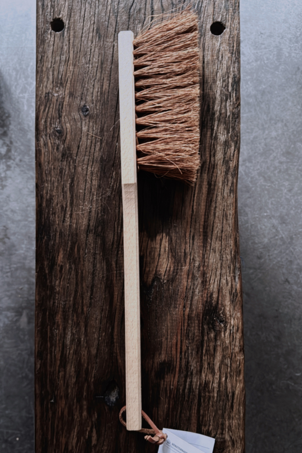 A natural BBQ brush by Redecker, crafted with coconut fibre bristles and a sturdy wooden handle.