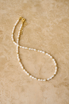 Indigo & Wolfe LACEY freshwater pearl necklace with gold accents on neutral background, shop online at Tomolly.