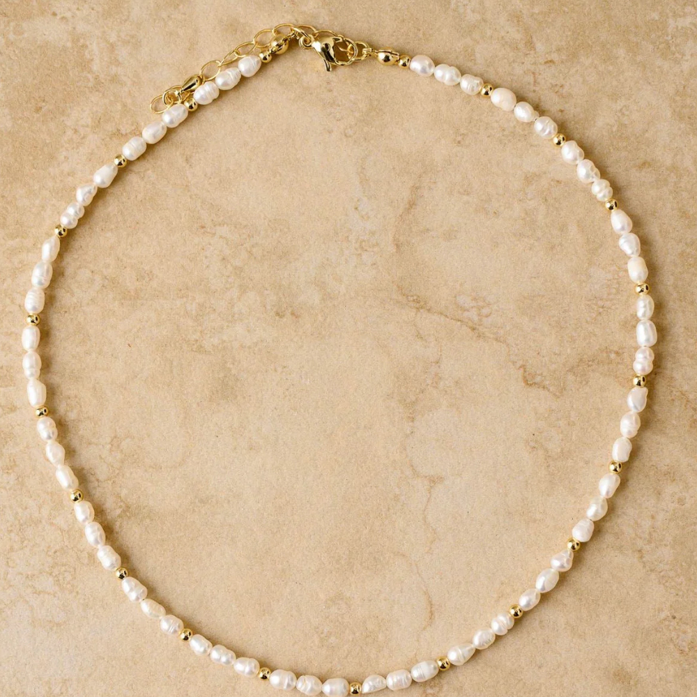 Indigo & Wolfe LACEY freshwater pearl necklace with gold accents on neutral background, shop online at Tomolly.