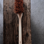A natural BBQ brush by Redecker, crafted with coconut fibre bristles and a sturdy wooden handle.