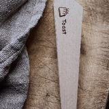 Redecker wooden toast tongs for safely removing toast shop at Tomolly.